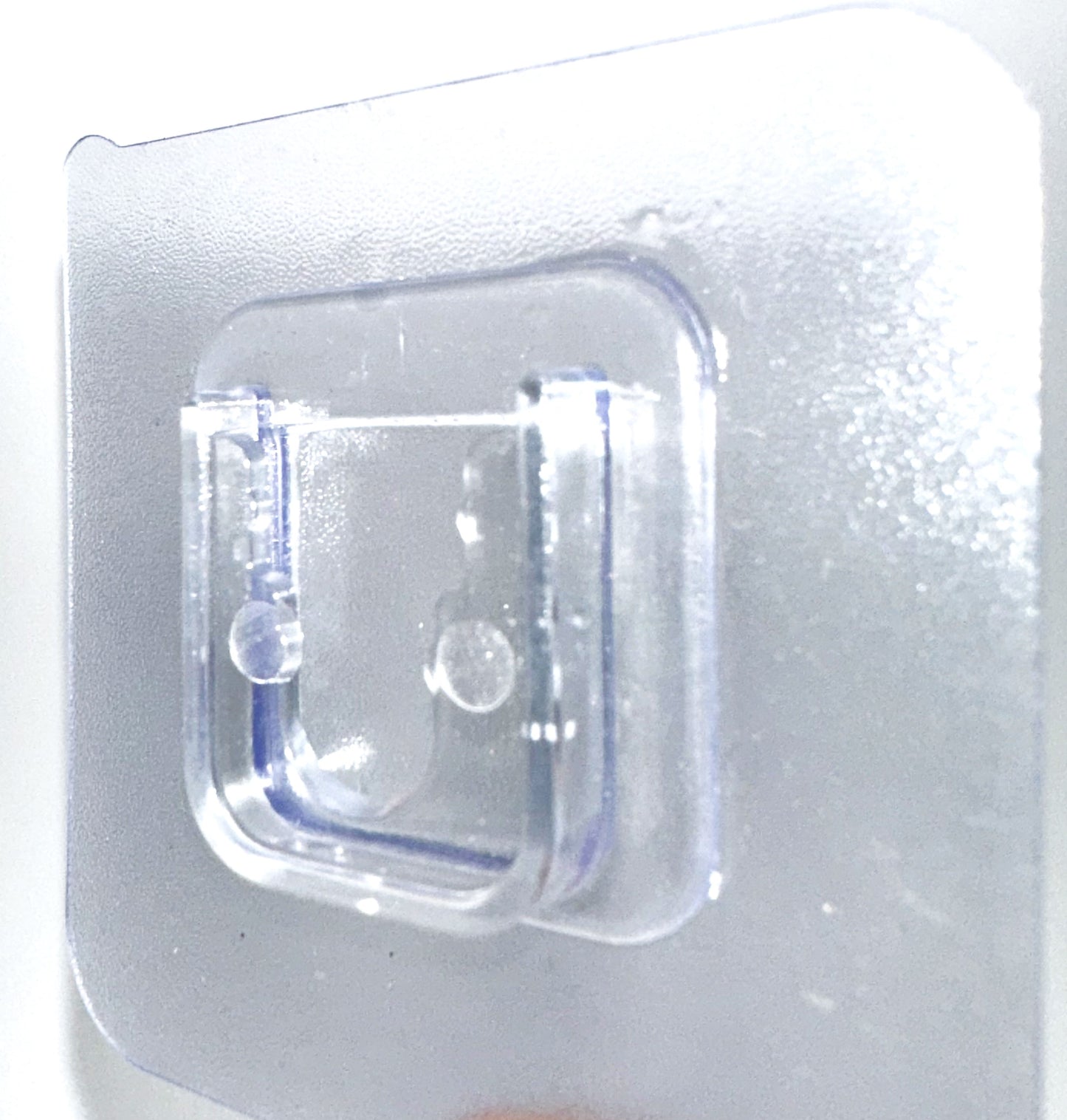 Branch holder -clear adhesive pads that sticks to the white PVC sides