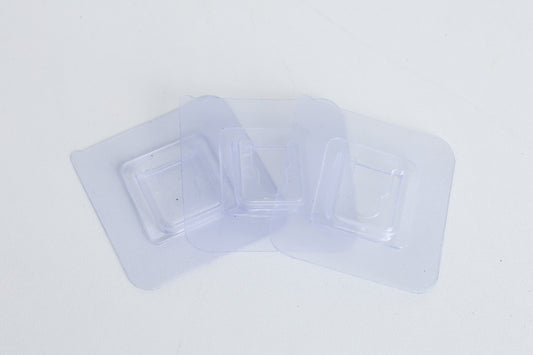 Branch holder -clear adhesive pads that sticks to the white PVC sides