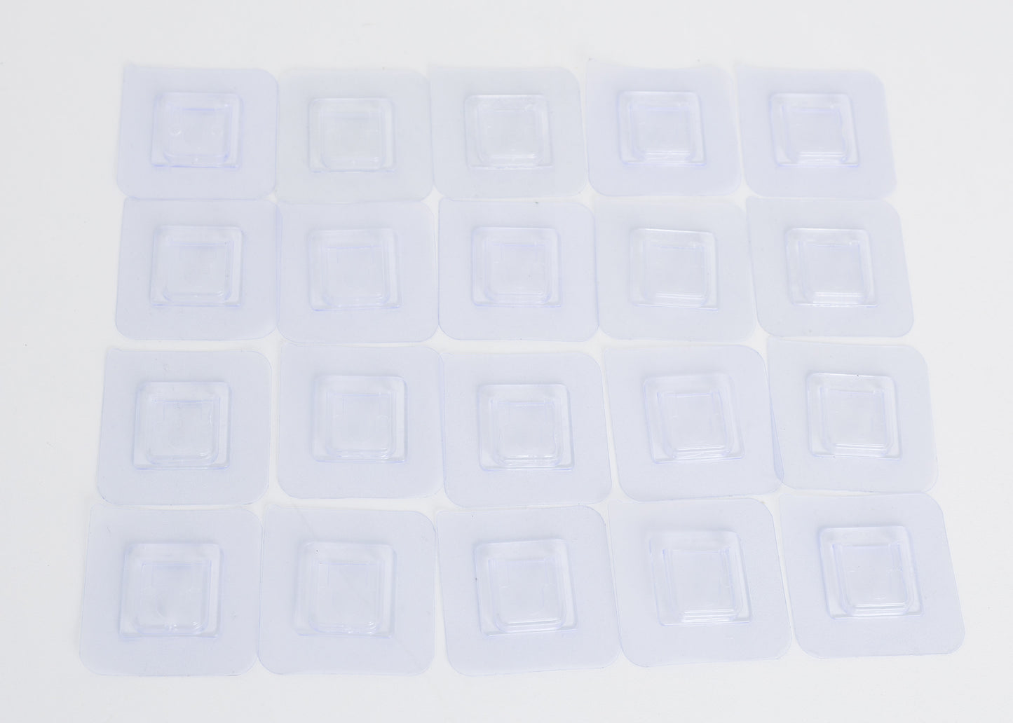 Branch holder -clear adhesive pads that sticks to the white PVC sides